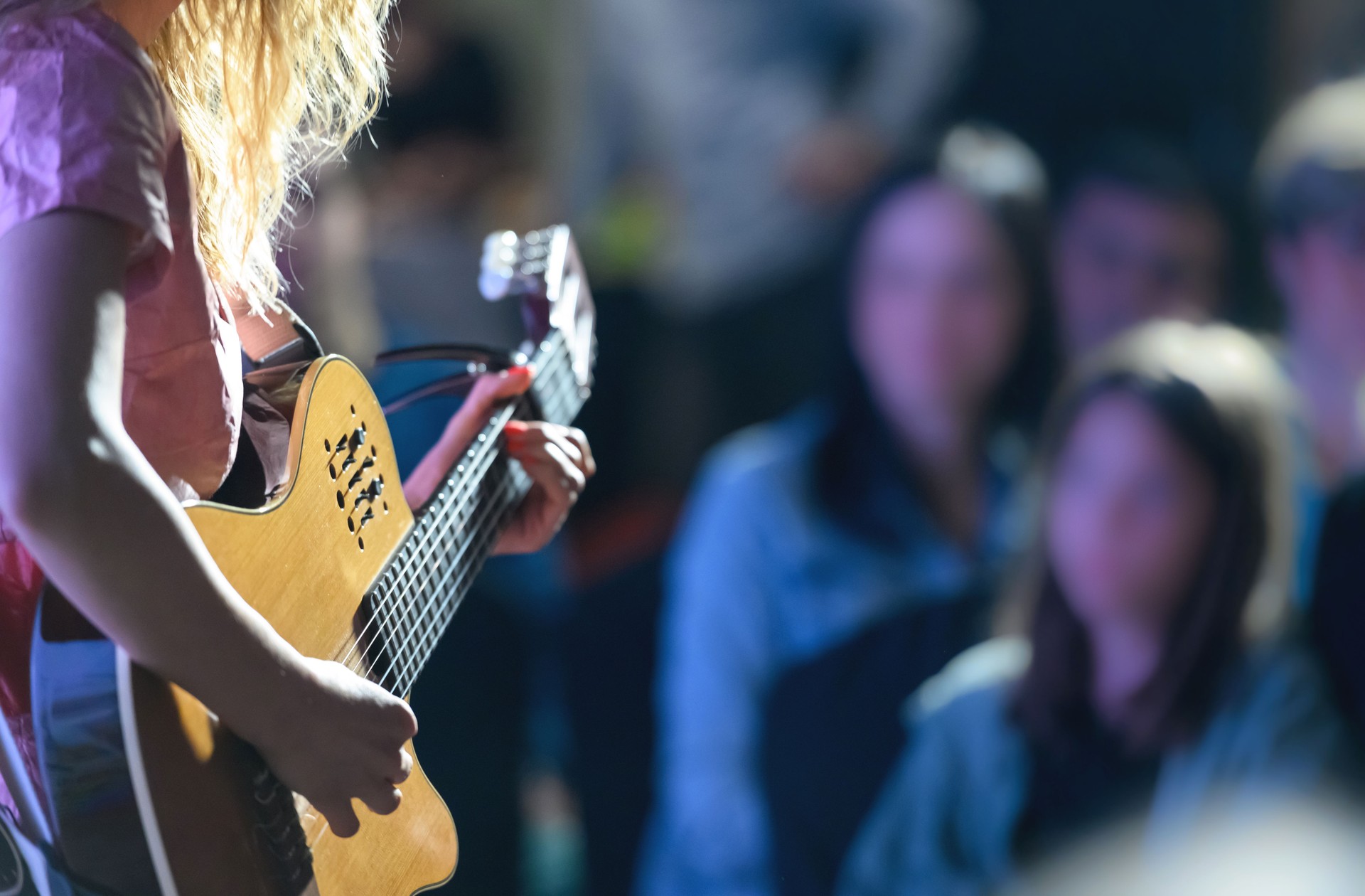 Playing the guitar at a concert